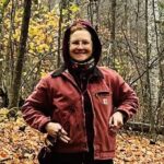 Anna Bierbrauer stands in a forest