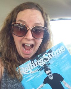 Meghan Kelly holds up a copy of the Rolling Stone Magazine. She published a map in the magazine this summer!