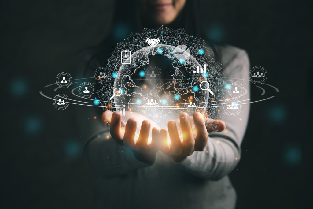 Hands holding an image of the world surrounded by data.