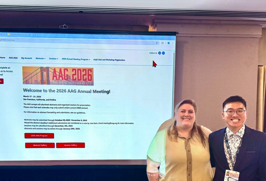 Benjamin Kao and c nelson pose together before a presentation