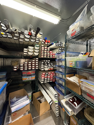 Scientific samples and equipment sit on shelves