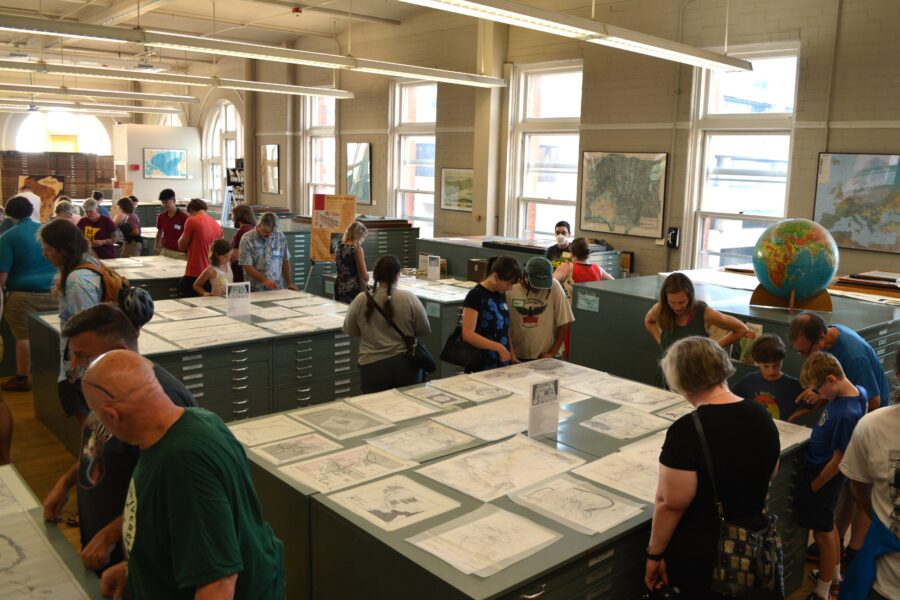 People looking at an exhibit in the Robinson Map Library