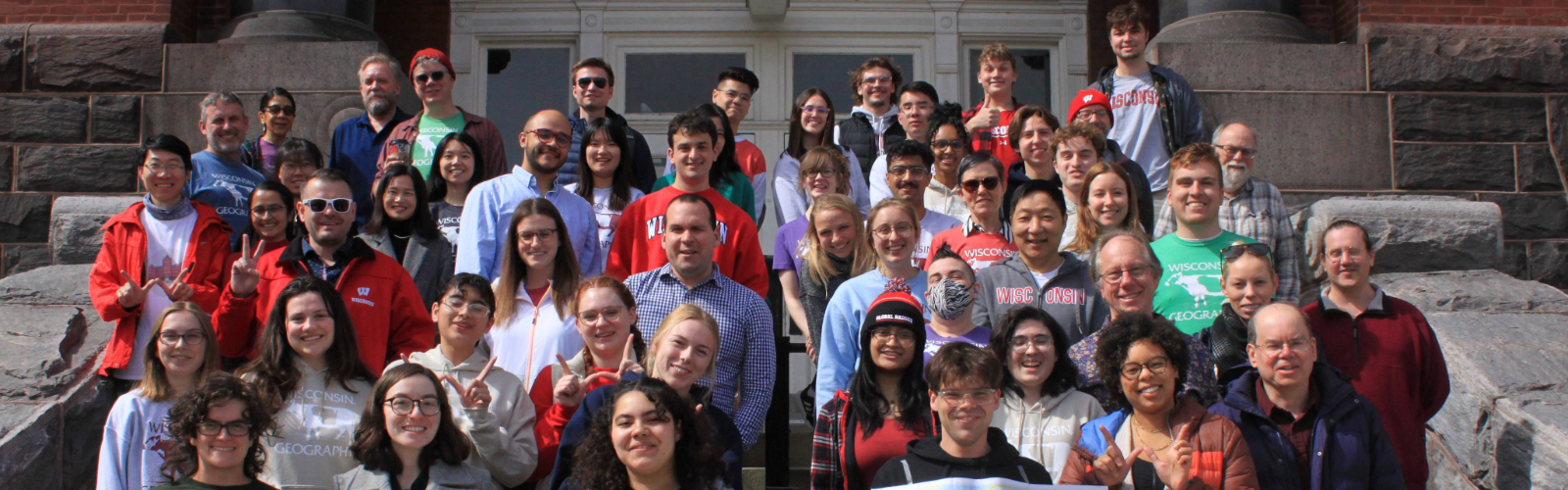 Students, faculty, and staff pose in front of Science Hall